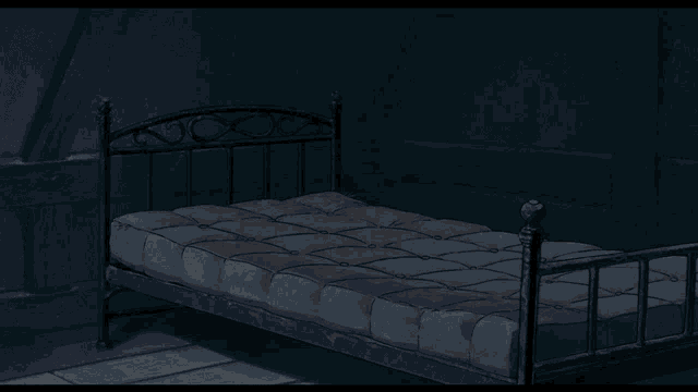 a girl holding a broom in front of a bed in a dark room