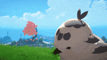 a bird is standing in a grassy field with a cherry blossom tree in the background