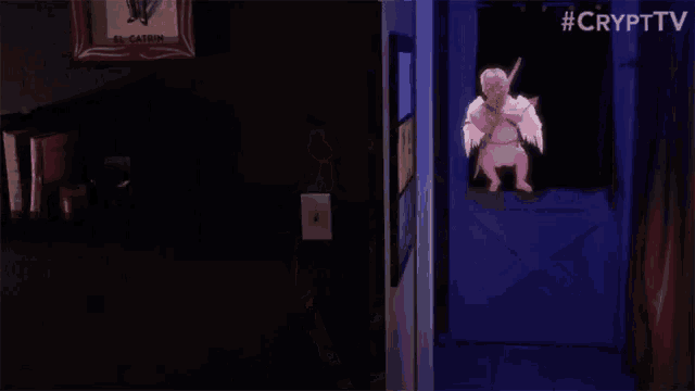 a cupid with a bow and arrow in a dark room