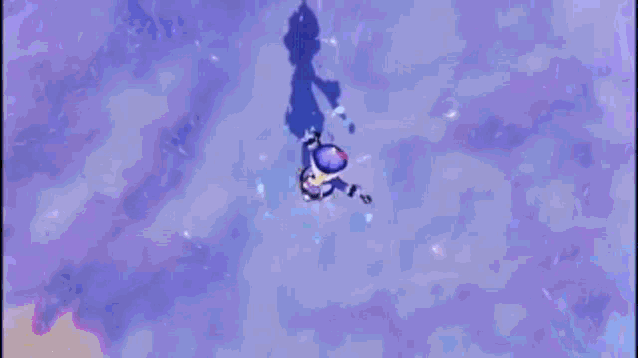 a blue background with a purple object in the middle of it