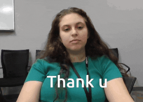 a woman in a green shirt says thank you