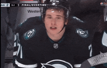 a hockey player wearing a jersey that says ' nfc ' on it