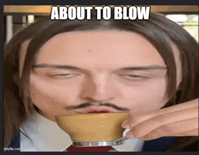 a man with long hair and a mustache is drinking from a cup with a caption that says about to blow .