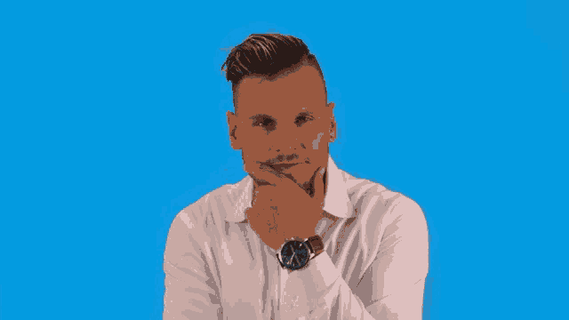 a man in a white shirt has his hand on his chin while wearing a watch