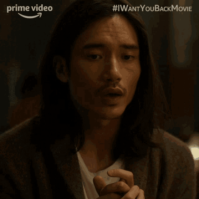 a man with long hair and a beard has the word yeah written on his face