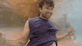 a man is swimming underwater in a pool .