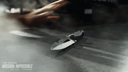 a movie poster for mission impossible the final decking shows a person holding a knife