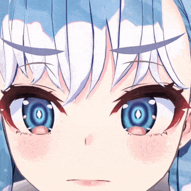 a close up of a girl 's eyes with a blue circle in the middle