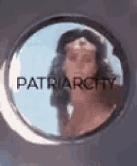 a close up of a woman in a circle with the words patriarchy written on it .