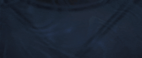 a person 's feet are visible in a dark room