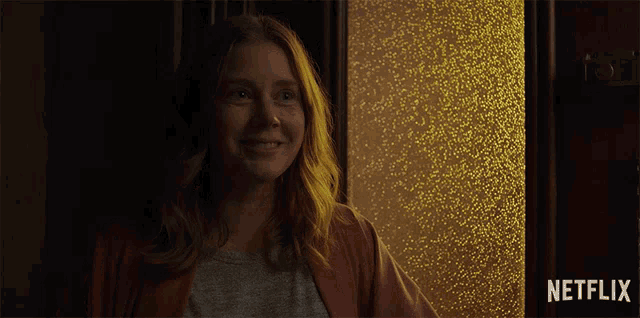 a netflix ad with a woman smiling and the words enjoy