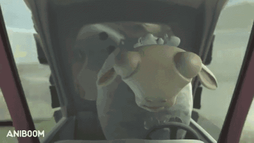 a cartoon sheep is driving a truck and the word aniboom is on the bottom of the screen