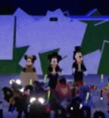 a blurry picture of mickey mouse and goofy standing on a stage