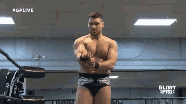 a man in a wrestling ring with #gplive on the bottom