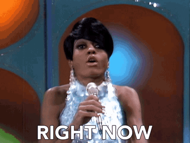 a woman singing into a microphone with the words right now written below her