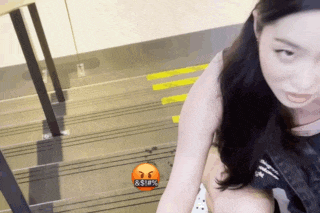 a woman is sitting on a set of stairs with a sticker that says ' 88 % ' on it