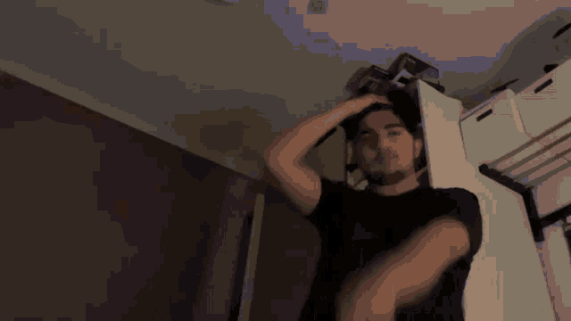 a man in a black shirt is standing in front of a screen that says marc x3