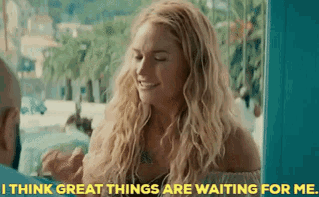 a woman says " i think great things are waiting for me " in yellow letters