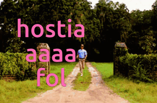a man walking down a dirt road with the words hostia aaa fol written in pink