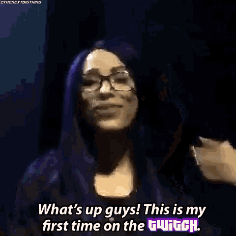 a woman with purple hair and glasses is saying what 's up guys this is my first time on the twitch .