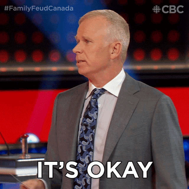a man in a suit and tie says it is okay
