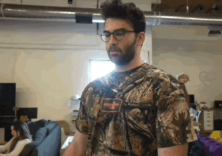 a man with glasses and a name tag that says johnson