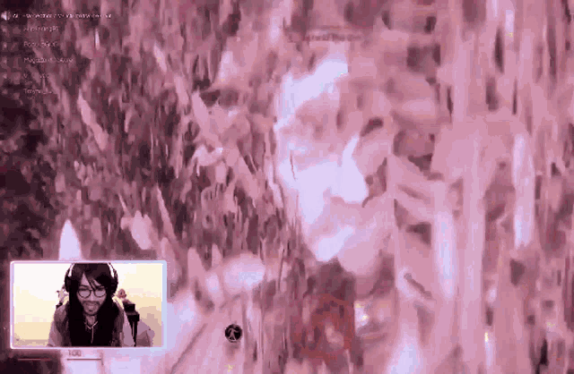 a woman is playing a video game with a pink background