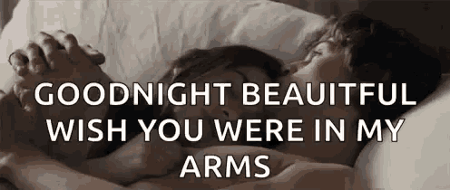 a man and a woman are hugging each other in a bed .