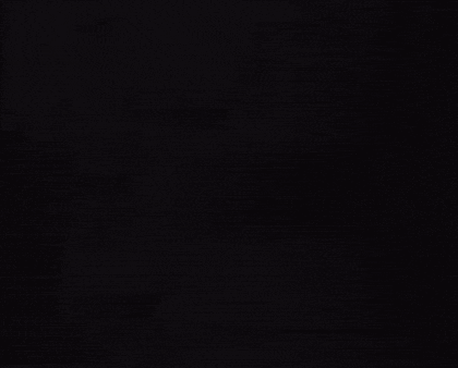 a black and white photo of a man 's face in the dark