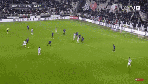 a soccer game is being played on a field with a banner that says bein