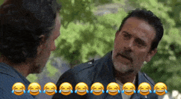 two men are laughing with tears coming down their eyes