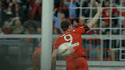a man in a red jersey with the number 9 on his back