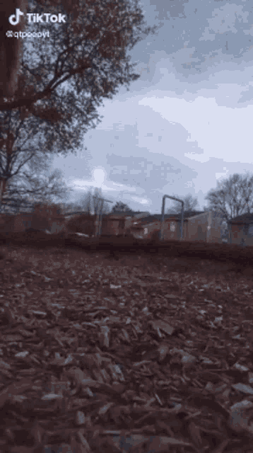 a tiktok video of a playground with a basketball hoop