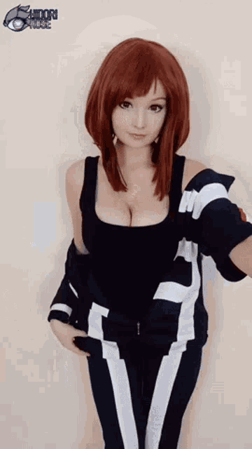 a woman with red hair is wearing a black and white outfit and a wig .
