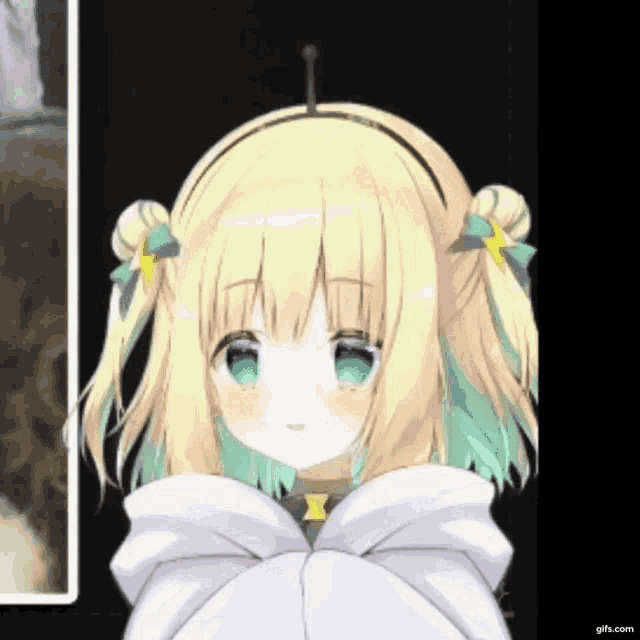 a girl with blonde hair and green eyes is wearing a white jacket
