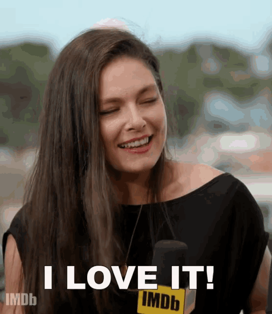 a woman says i love it while smiling