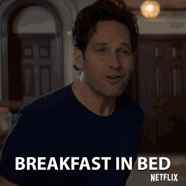 a man in a blue shirt says breakfast in bed on a netflix poster