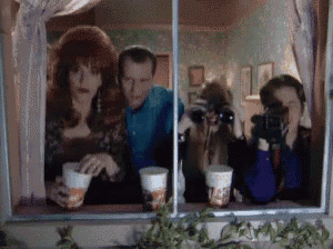 a group of people are taking a picture of themselves in a mirror