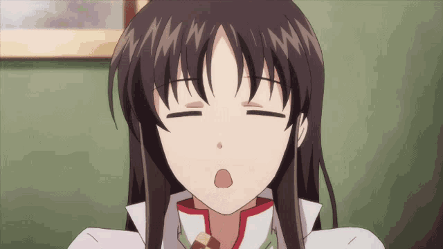 a close up of a girl with her eyes closed and her mouth open