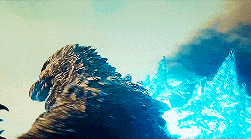 a close up of a giant monster with smoke coming out of its mouth .