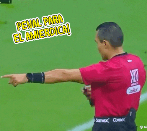 a soccer referee is pointing at something with the words penal para el amierdica above him