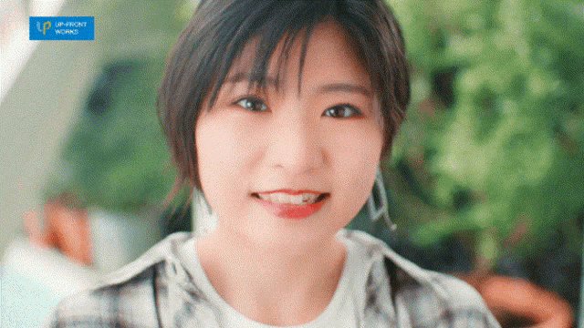 a close up of a woman 's face with the word upfront visible in the corner