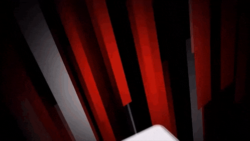 a red white and black background with a white object in the middle