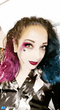 a woman has a tattoo on her face that says " wotten "