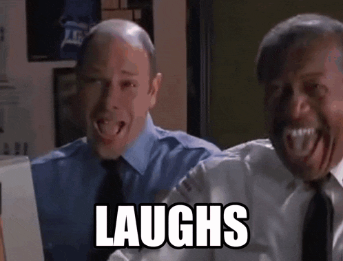two men are laughing while looking at a computer screen with the word laughs above them