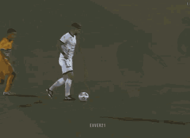 a soccer player in a yellow jersey with the number 3 on it