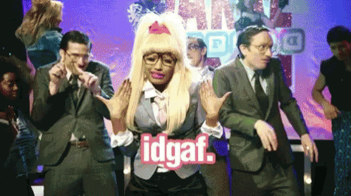 a group of people are dancing and one of them has the word idgaf in pink