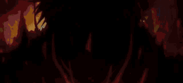 a person is standing in a dark room with a blue light coming out of it .