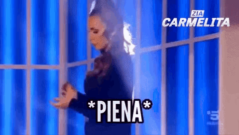 a woman is dancing in front of a blue background that says ' zia carmelita '