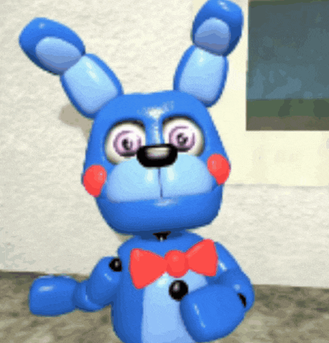 a blue stuffed bunny with red cheeks and a bow tie